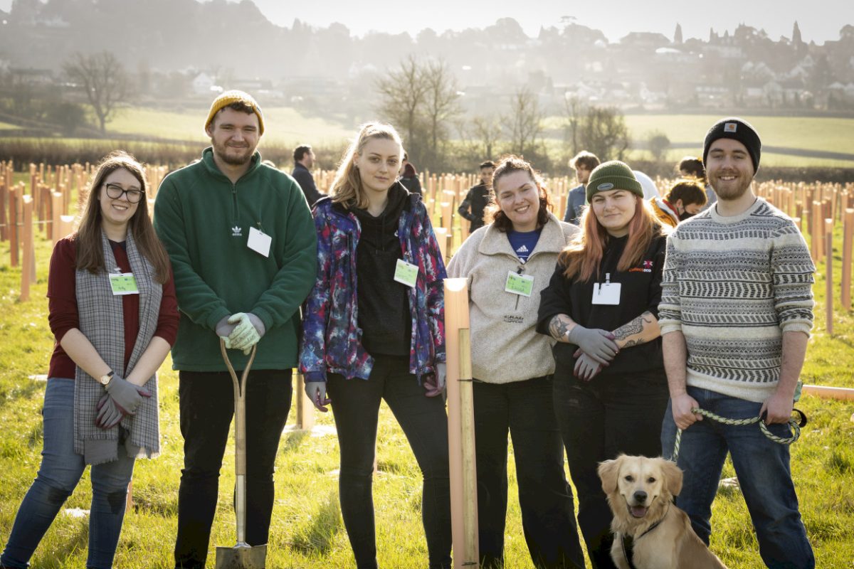 Netplanting – happy planters and happy trees –  helping plant a woodland for the future